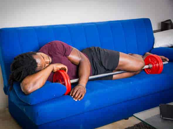 young strong black male sleeping on couch:does mk-677 improve sleep quality