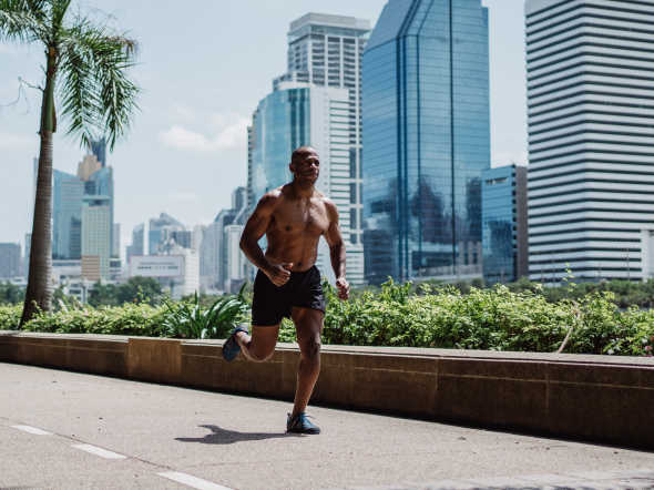 shirtless bodybuilder running